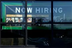 The number of Americans filing for jobless benefits last week rises to highest level in eight months